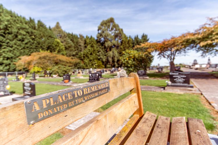 Waikaka Cemetery - Image showing graves with bench in the foreground